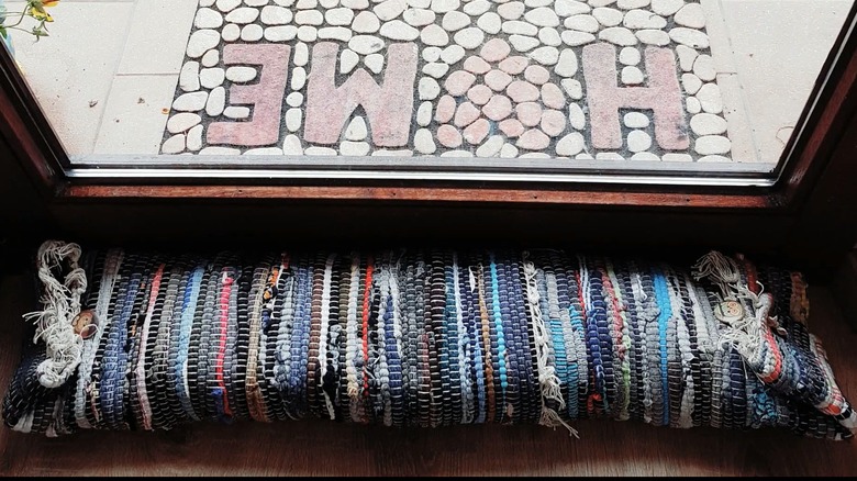 Homemade draft stopper by a front door