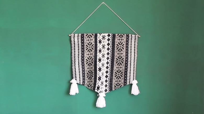 Stylish wall banner tapestry made from cloth material with tassels