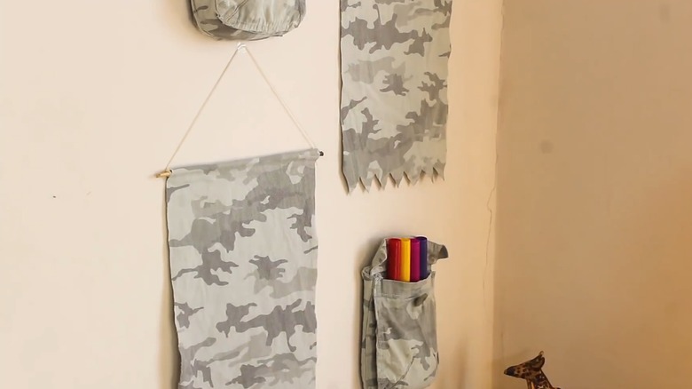 Hanging garments repurposed in wall decor with pockets for storage