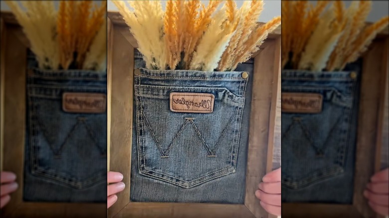 Framed jean pocket with artificial grassy foliage