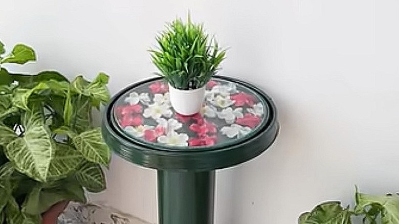 Constructing a small table from plastic lid and PVC pipe