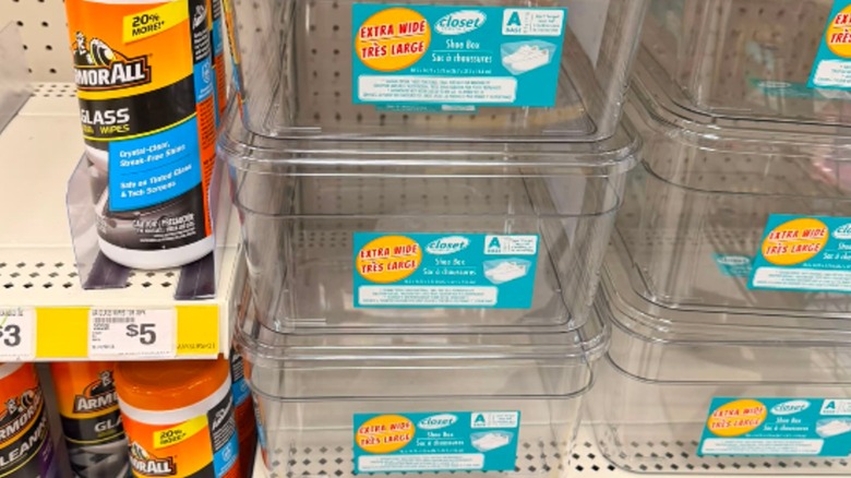 Extra wide clear plastic shoeboxs on the shelves at Dollar Tree.