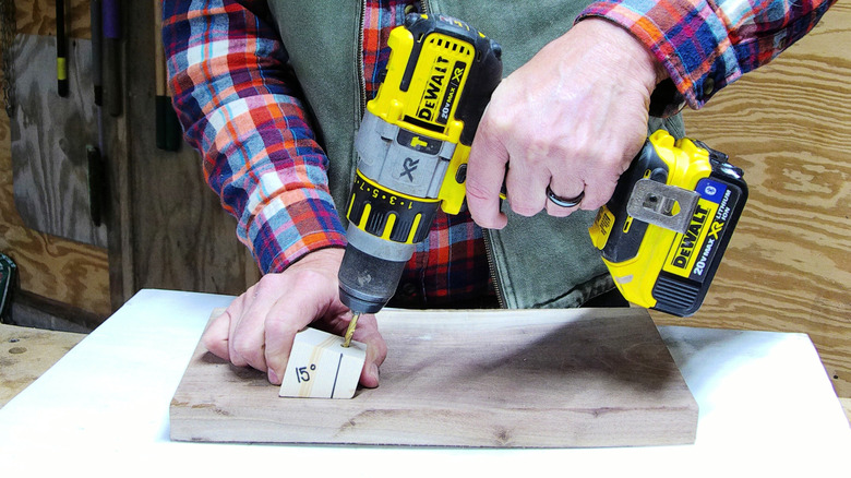 Using a drill guide block to bore and angled hole