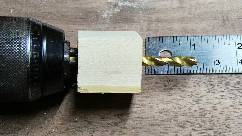Wooden stop block on a drill bit