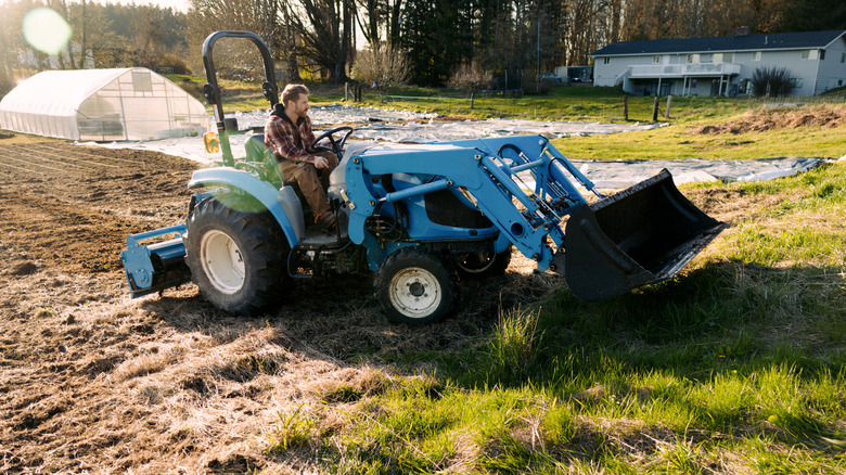 Driving tractor over uneven terrain