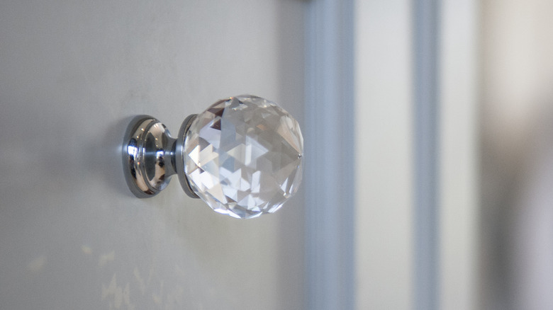 crystal hardware knob on gray cabinet
