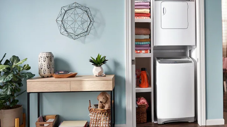 A Whirlpool compact washing machine and dryer in a closet
