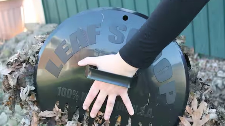 Person using a set of Bully Tools 1000 Poly Leaf Scoops.