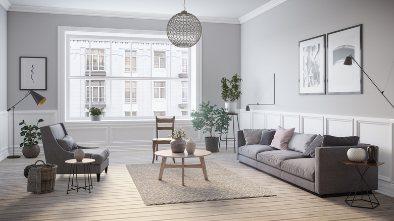 A room with gray walls and gray furniture.