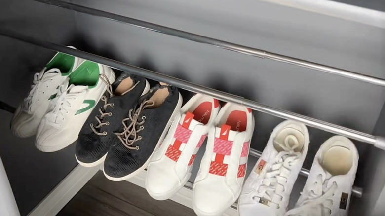 DIY tension rod shoe shelves in a closet