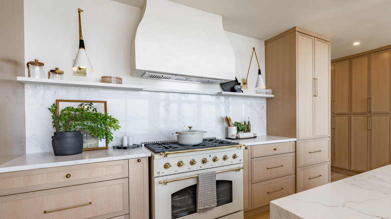modern kitchen with a slab stone backsplash with ledge