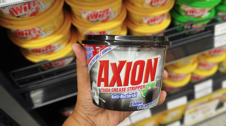 A tub of Axion dishwashing paste.