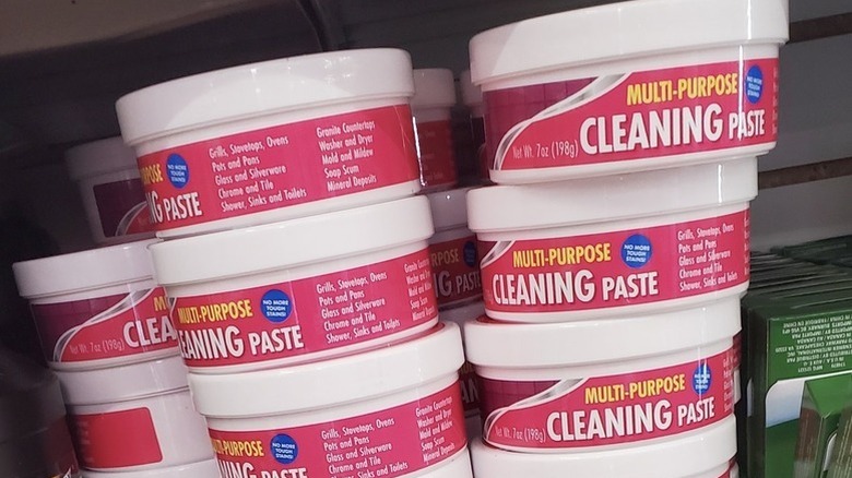 Pink pots of Multi-Purpose Cleaning Paste sit on the shelves at Dollar Tree