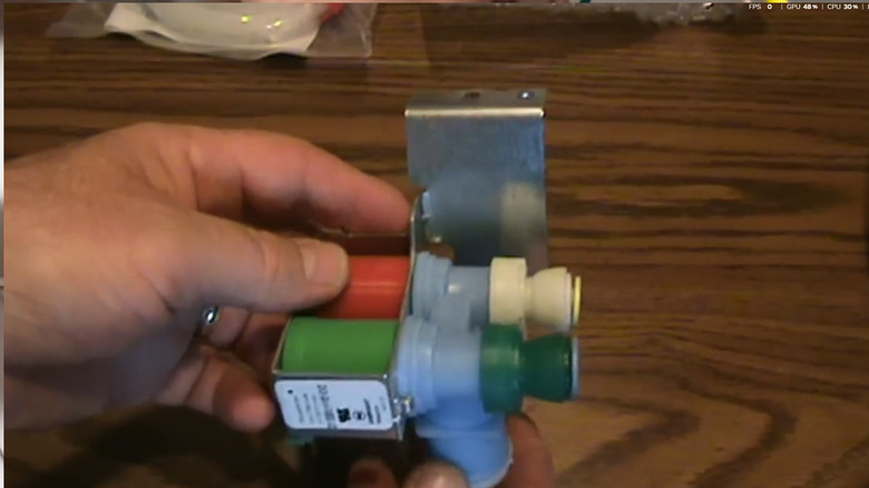 A replacement water inlet valve for a Kenmore refrigerator