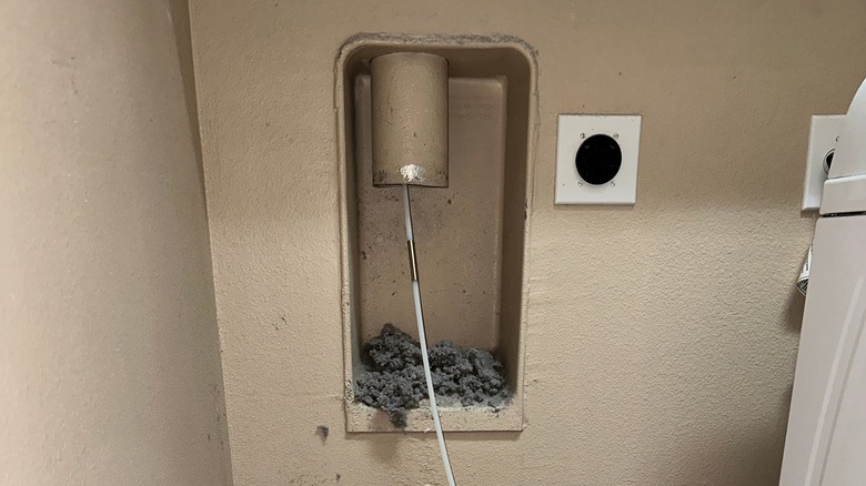 lint fallen out of a dryer vent