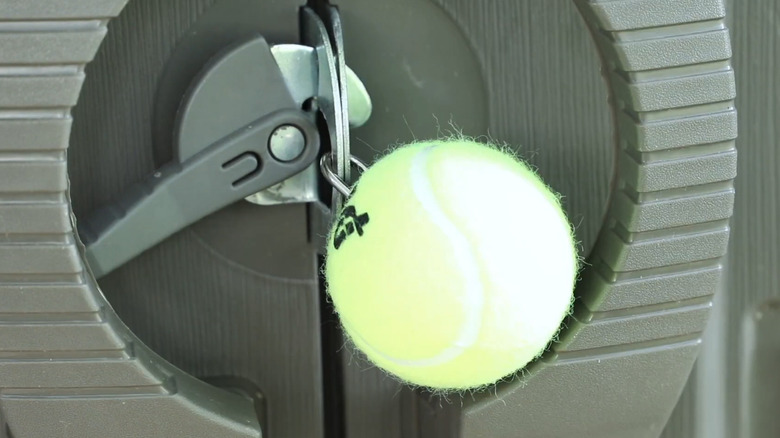 Protecting a padlock with a tennis ball