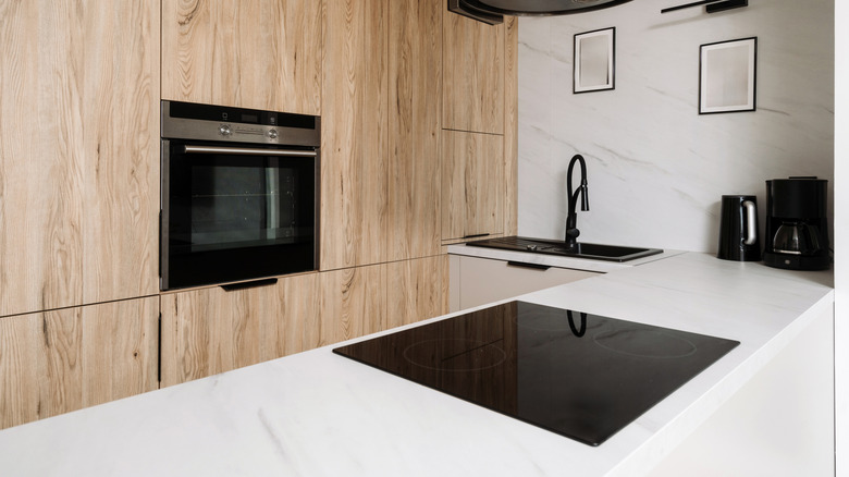 Kitchen island with a built-in cooktop.