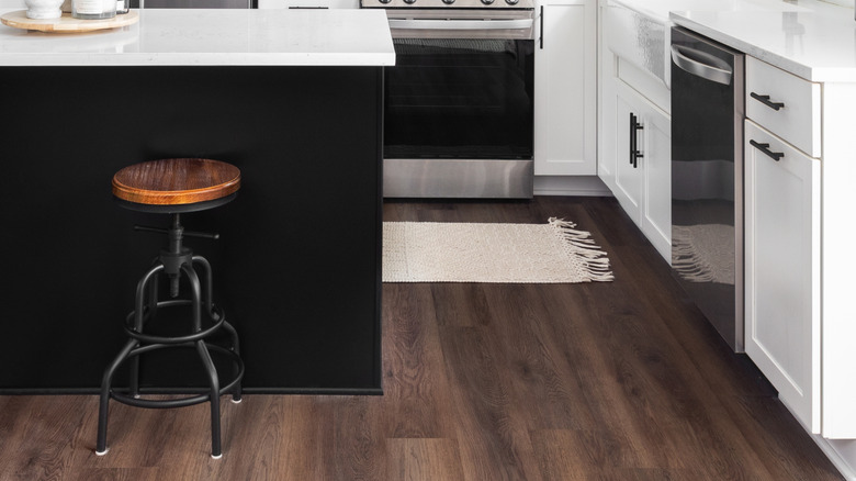 Stainless appliances in a white kitchen