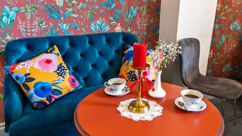 maximalist design with bright colors, mismatched patterns and various style eras
