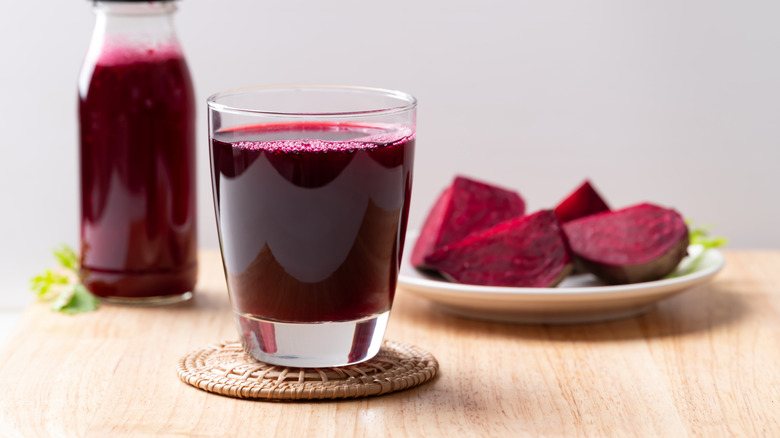 beet slices and beet juice in a glass