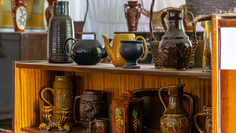 Vintage shelf with a collection of ceramic jugs and pots