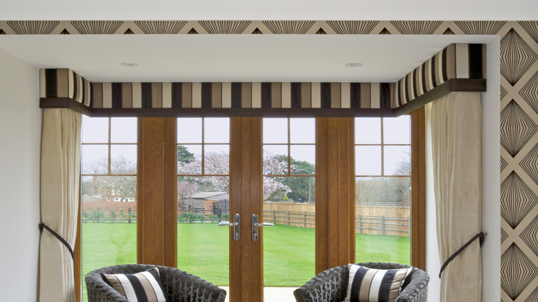 Valance at the top of a set of windows and doors.