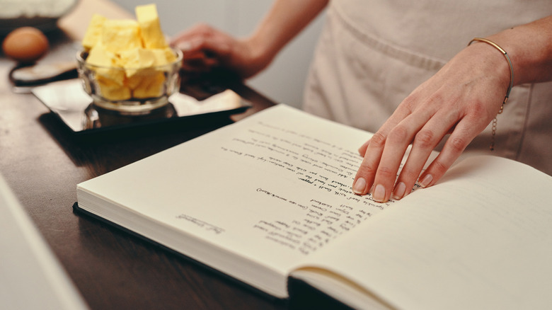 Person looking through a recipe book