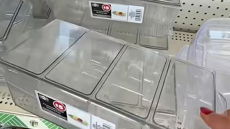 Displayed clear plastic storage trays on store shelf