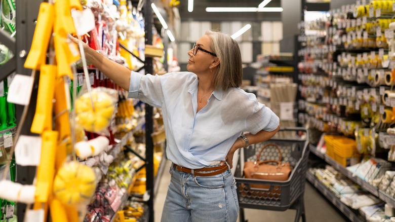 Woman shopping for items in the Home section of a store