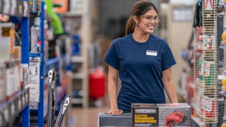 Harbor freight employee with a chainsaw-sharpening tool