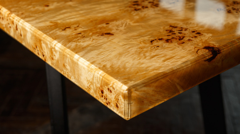 A highly polished burled poplar table