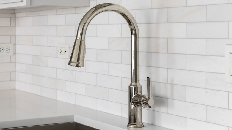 A brushed stainless steel kitchen faucet