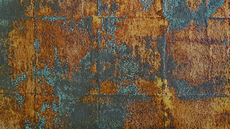Wall with a faux rust and oxidized copper finish