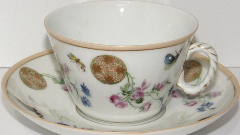 A Haviland meadow visitors teacup on display