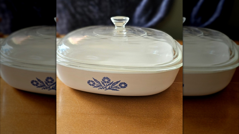 A CorningWare blue cornflower casserole dish on a table