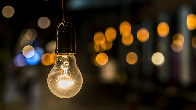 a warm light bulb in an outdoor space