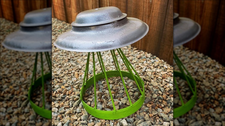 Small UFO sculpture made from a pot lid and scrap metal