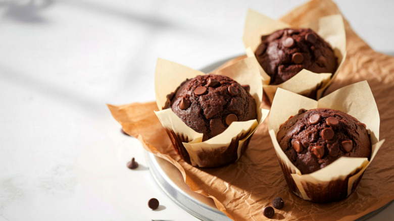 Chocolate chip muffing in parchment paper liners
