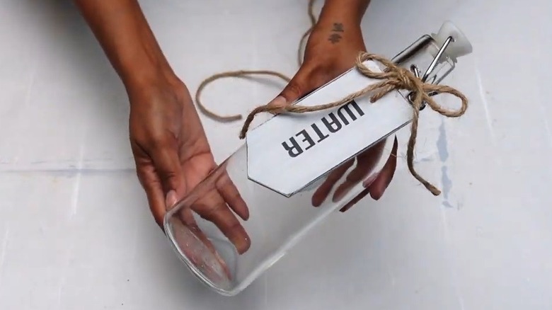 Label tag on bottle made from wooden blind slat