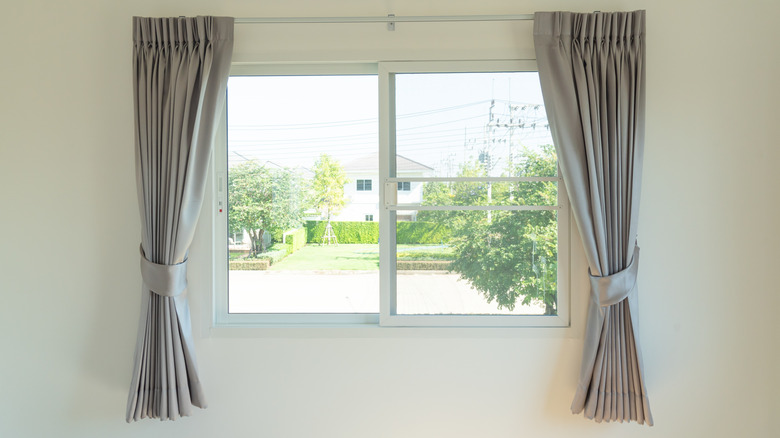 Short gray curtains on a window