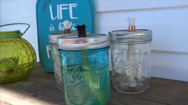Three Mason jar tiki torches