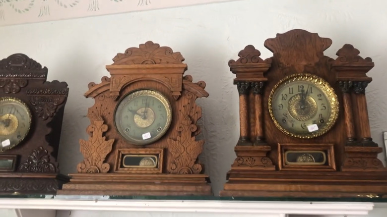 A trio of wooden antique mantel clocks