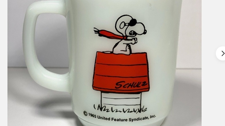 Snoopy as the red baron on a 1965 Fire-King milk glass mug