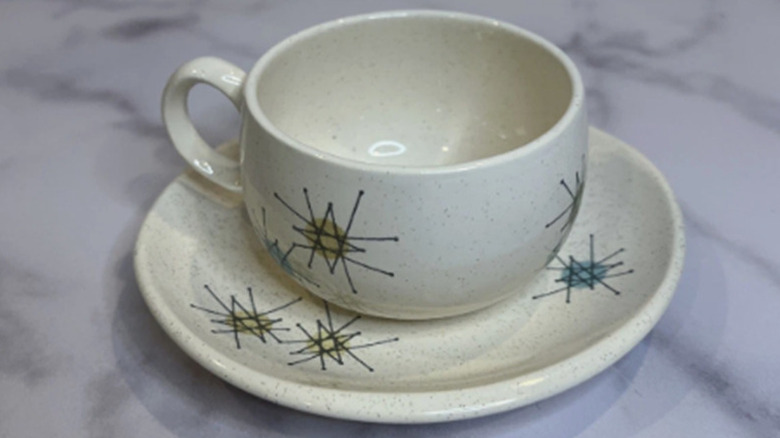 Close-up of a starburst pattern cup and saucer.