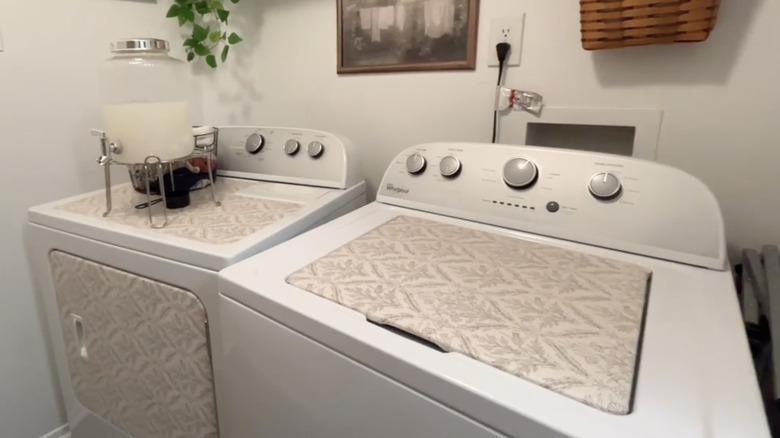 Contact paper applied to washer and dryer in laundry room.