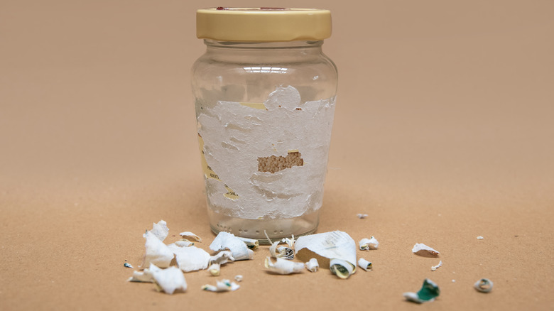 Jar with label peeled off and residue and paper left behind