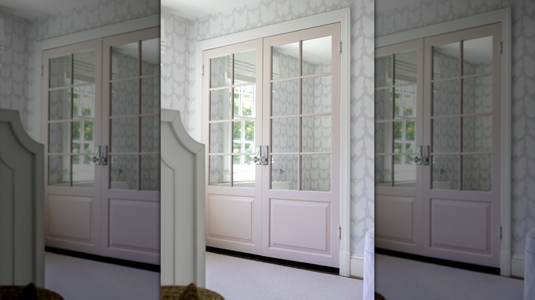 interior double french door painted in a soft shade of pale pink