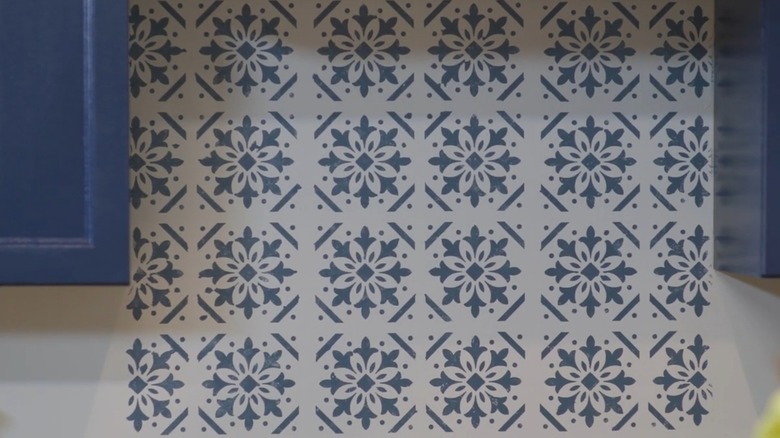 A stencil paint job on a kitchen backsplash