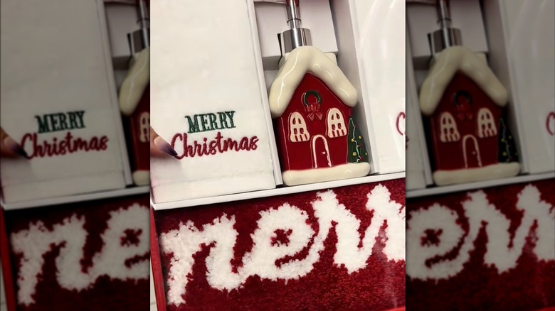 a woman holds an Aldi holiday bathroom set