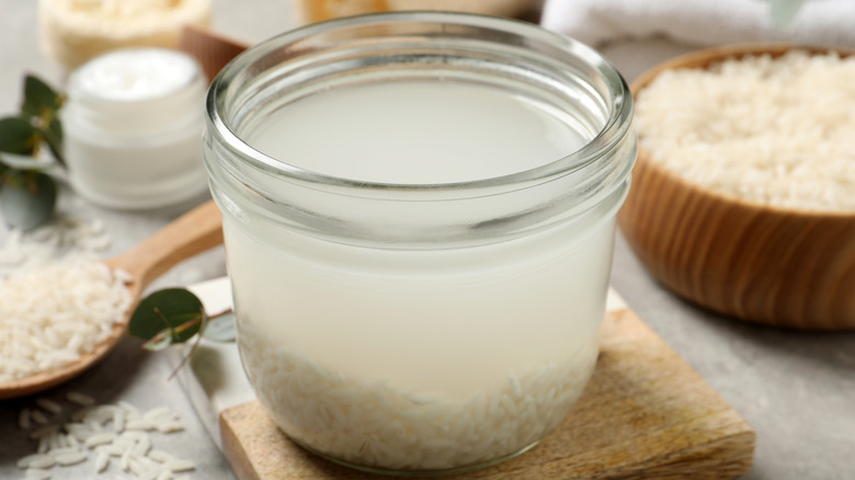Preparing rice water in a glass jar